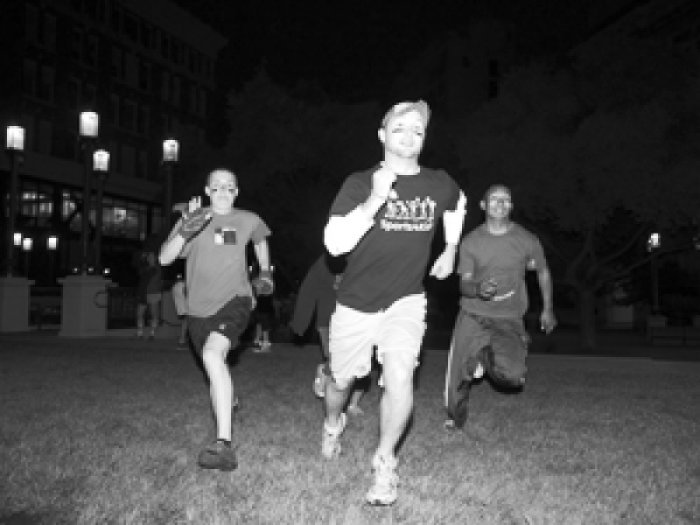 people running and playing capture the flag